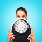weight loss scale woman and her goals, weight loss and wellness solutions, san antonio texas